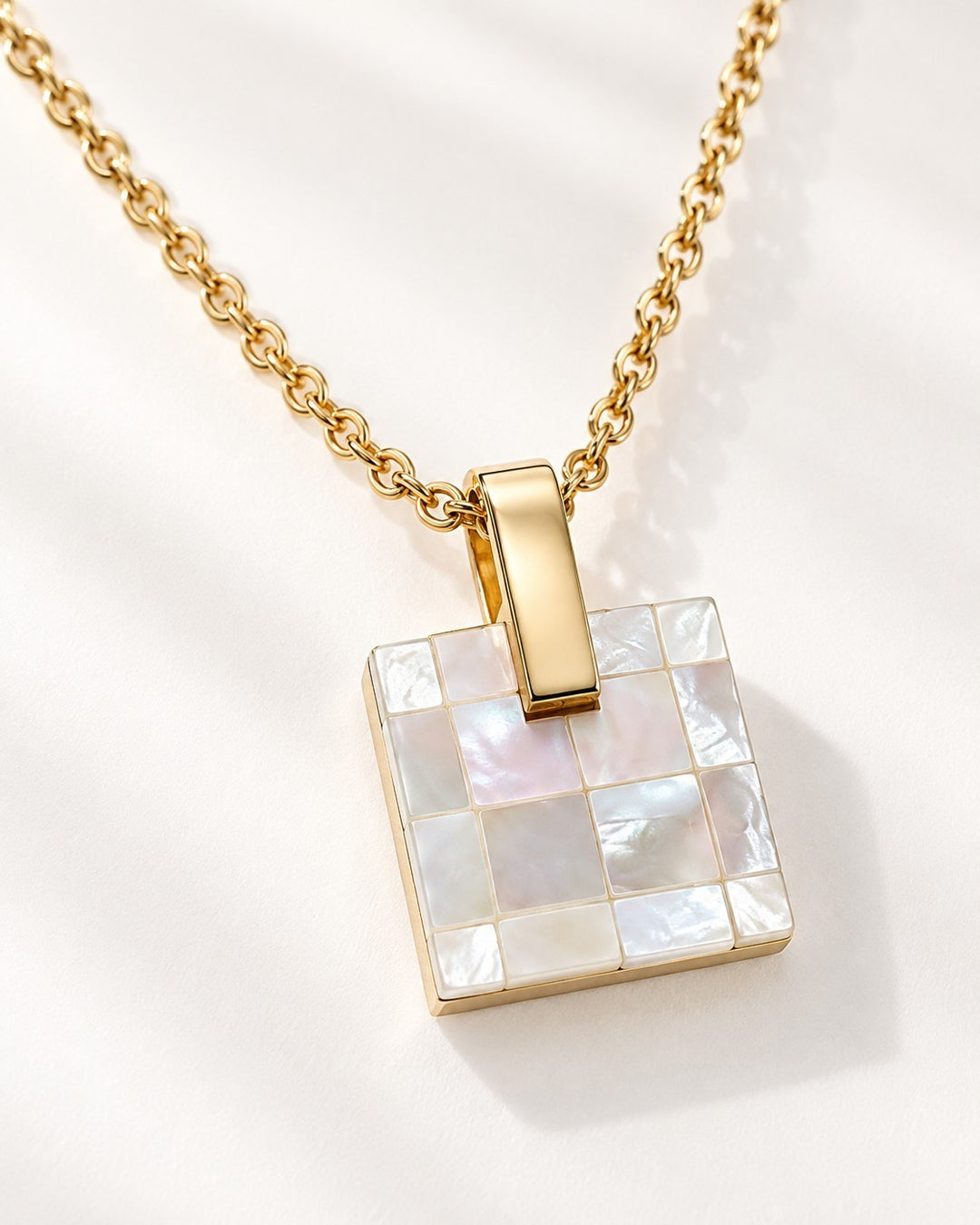 Elli Jewellery gold plated square pendant necklace featuring a mosaic mother-of-pearl shell inlay on a delicate chain.
