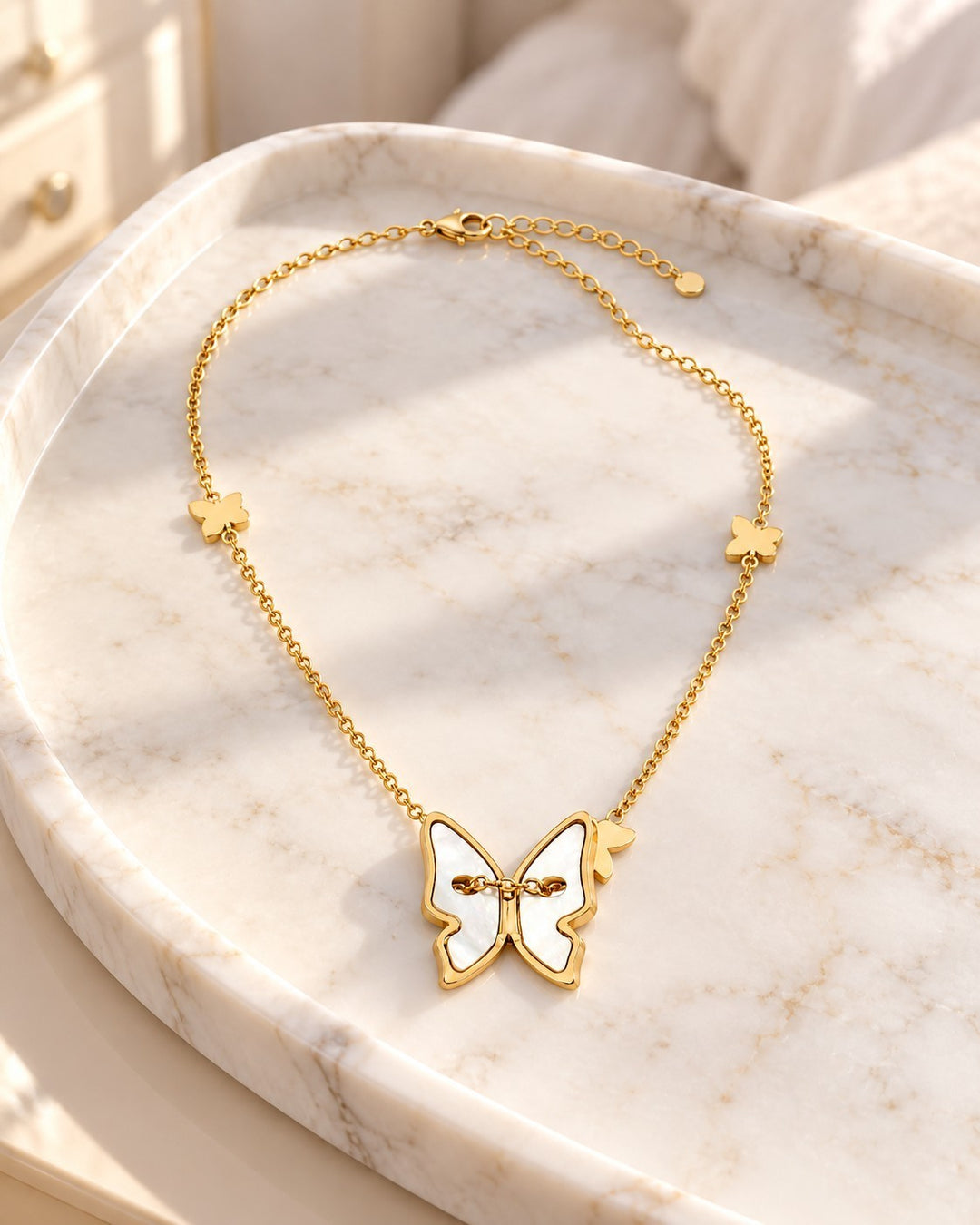 Elli Jewellery gold plated necklace featuring a mother of pearl butterfly pendant on a delicate chain