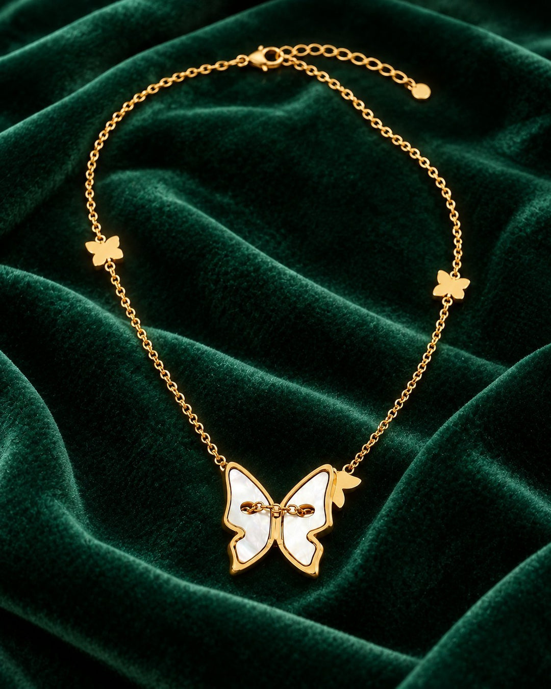 Elli Jewellery gold plated necklace featuring a mother of pearl butterfly pendant on a delicate chain with accents.