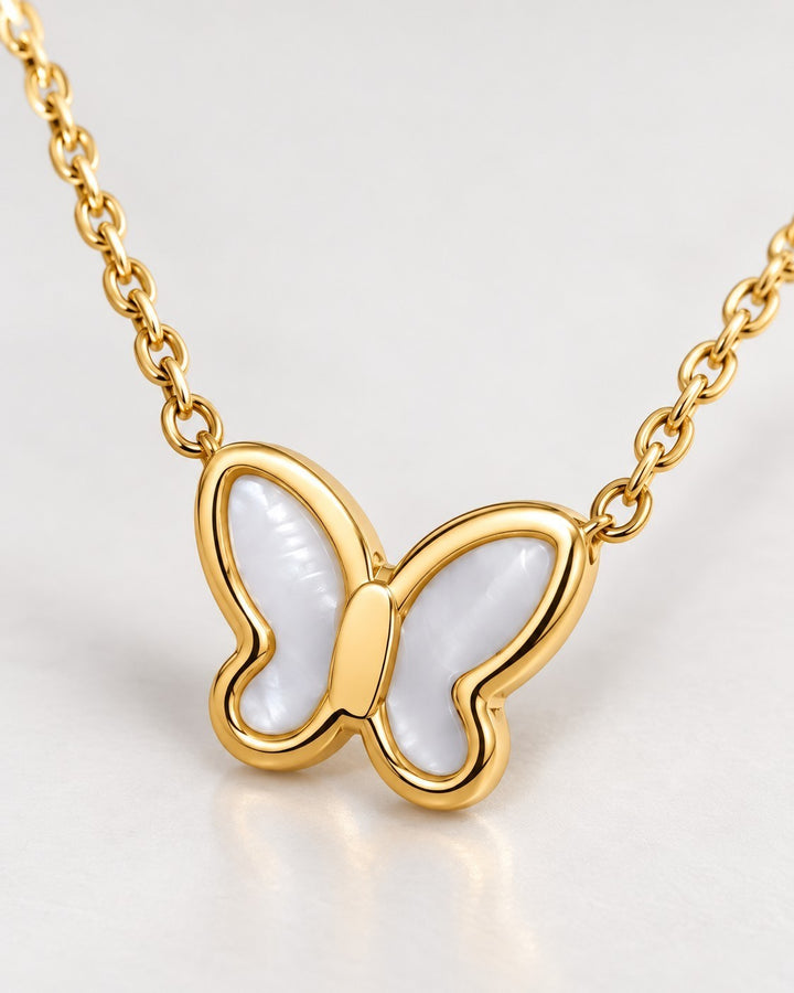 Elli Jewellery gold plated butterfly pendant necklace featuring iridescent mother of pearl inlay on a delicate chain