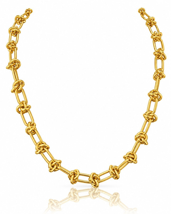 Elli Jewellery gold plated waterproof oval link chain necklace with chunky interlocking knots on a white background