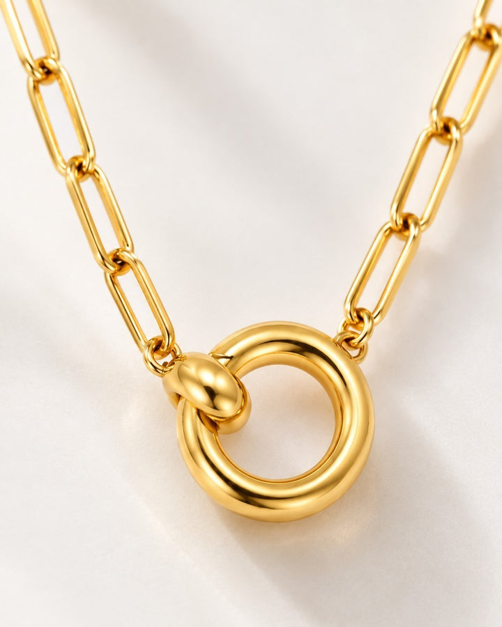 Elli Jewellery gold plated waterproof paperlink chain necklace with a sleek round pendant on a white background