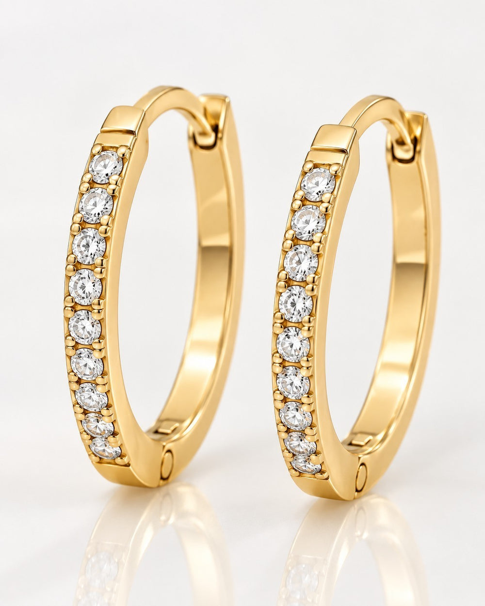 Elli Jewellery gold plated hoop earrings featuring a row of sparkling pavé-set clear crystals and hinged closures.