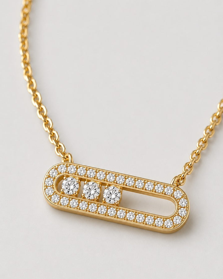 Elli Jewellery gold plated necklace featuring an elongated oval pendant with pavé crystals and three central stones.