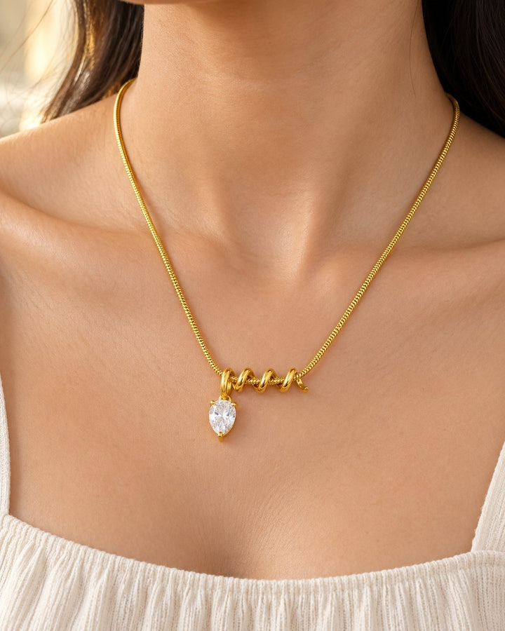 Elli Jewellery gold plated necklace featuring a pear shaped diamante crystal pendant on a delicate chain
