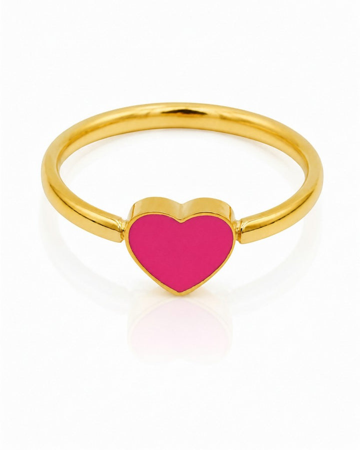 Elli Jewellery gold plated ring featuring a vibrant pink enamel heart design on a polished band