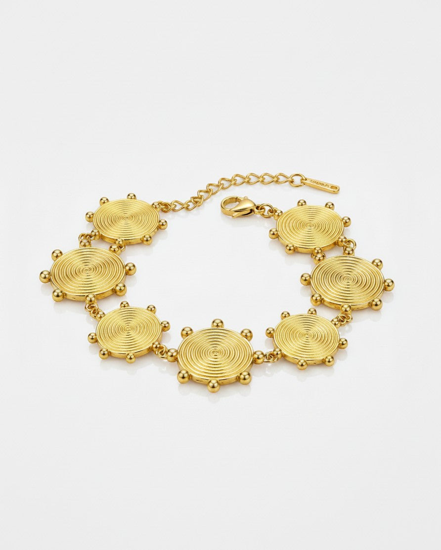 Elli Jewellery gold plated waterproof bracelet featuring circular textured charms with delicate bead accents