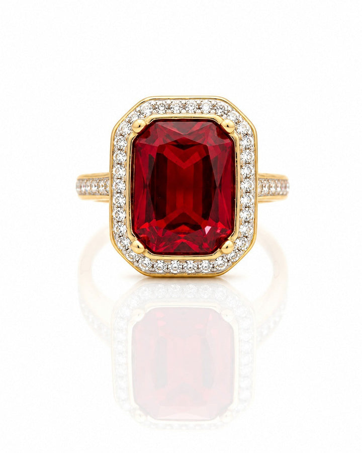 Elli Jewellery gold plated statement ring featuring a large rectangular red crystal surrounded by sparkling stones.
