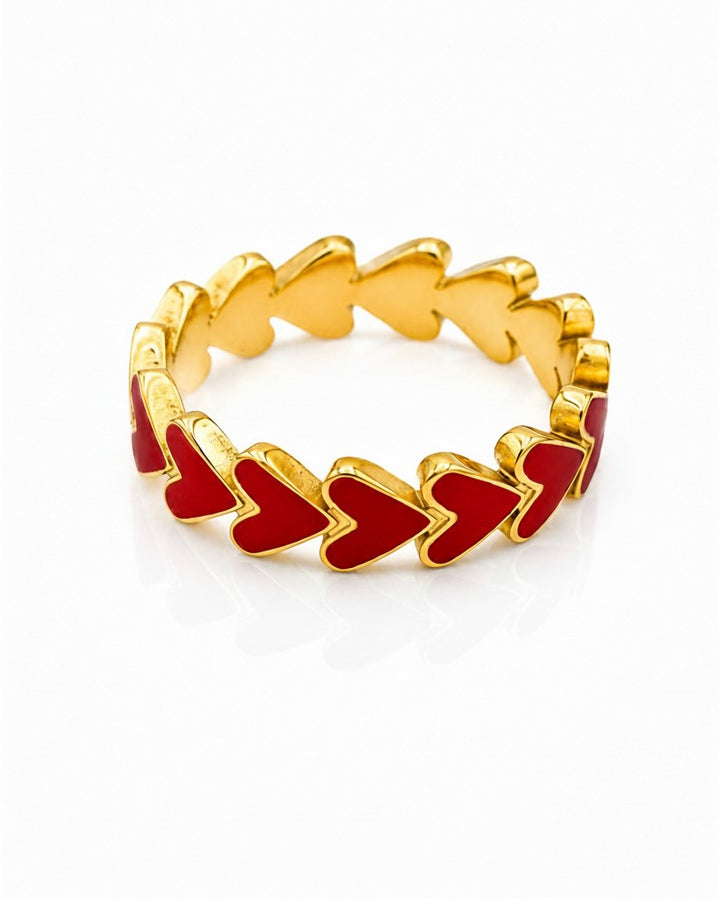 Elli Jewellery gold plated ring featuring a continuous band of vibrant red enamel hearts in a cluster design.