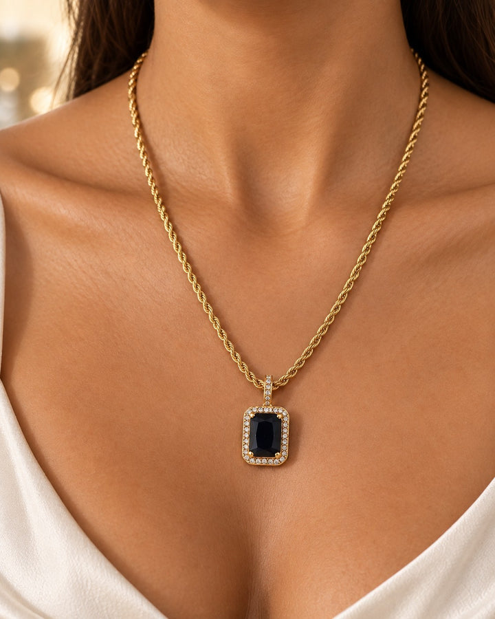 Elli Jewellery gold plated rope chain necklace with a rectangular black crystal pendant framed by small white stones.