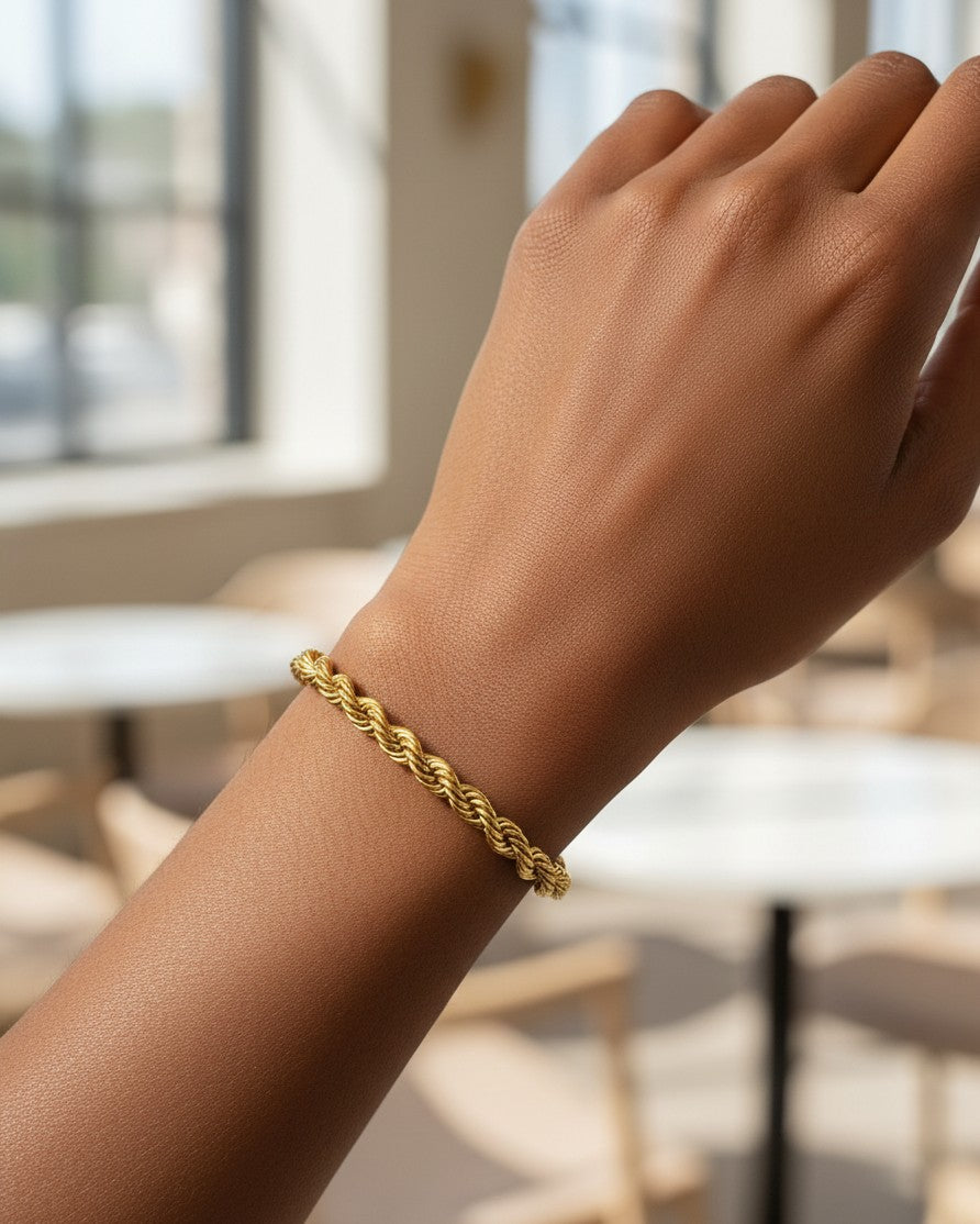 Elli Jewellery gold plated rope chain bracelet worn on a wrist, showcasing a delicate and waterproof design.
