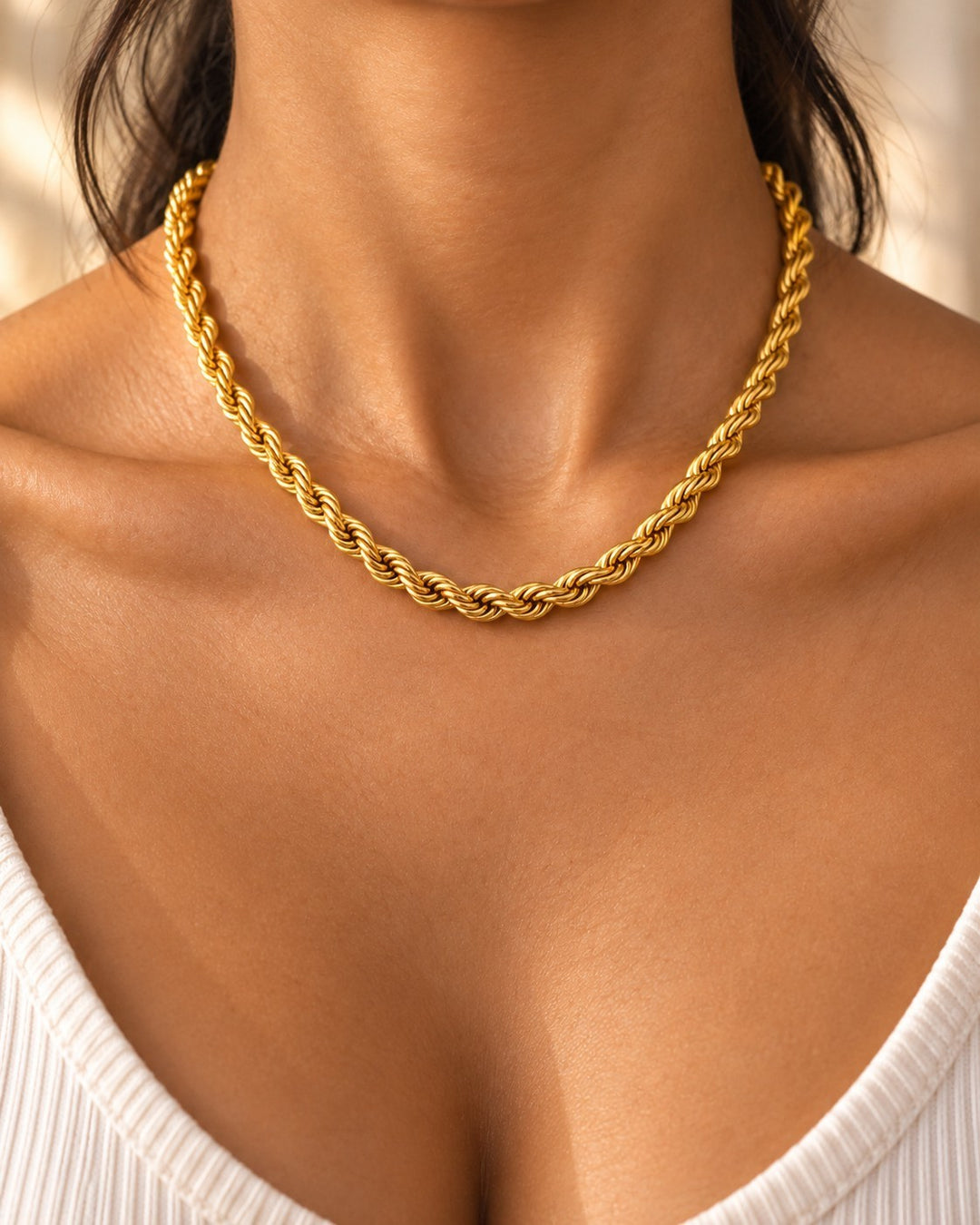 Elli Jewellery gold plated waterproof rope chain necklace with a textured twisted design worn around the neck