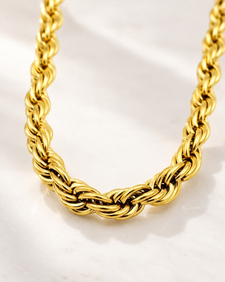 Elli Jewellery gold plated chunky rope chain necklace with a textured, waterproof design on a white surface.