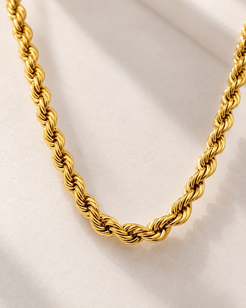 Elli Jewellery gold plated waterproof rope chain necklace with a textured twisted design on a white surface
