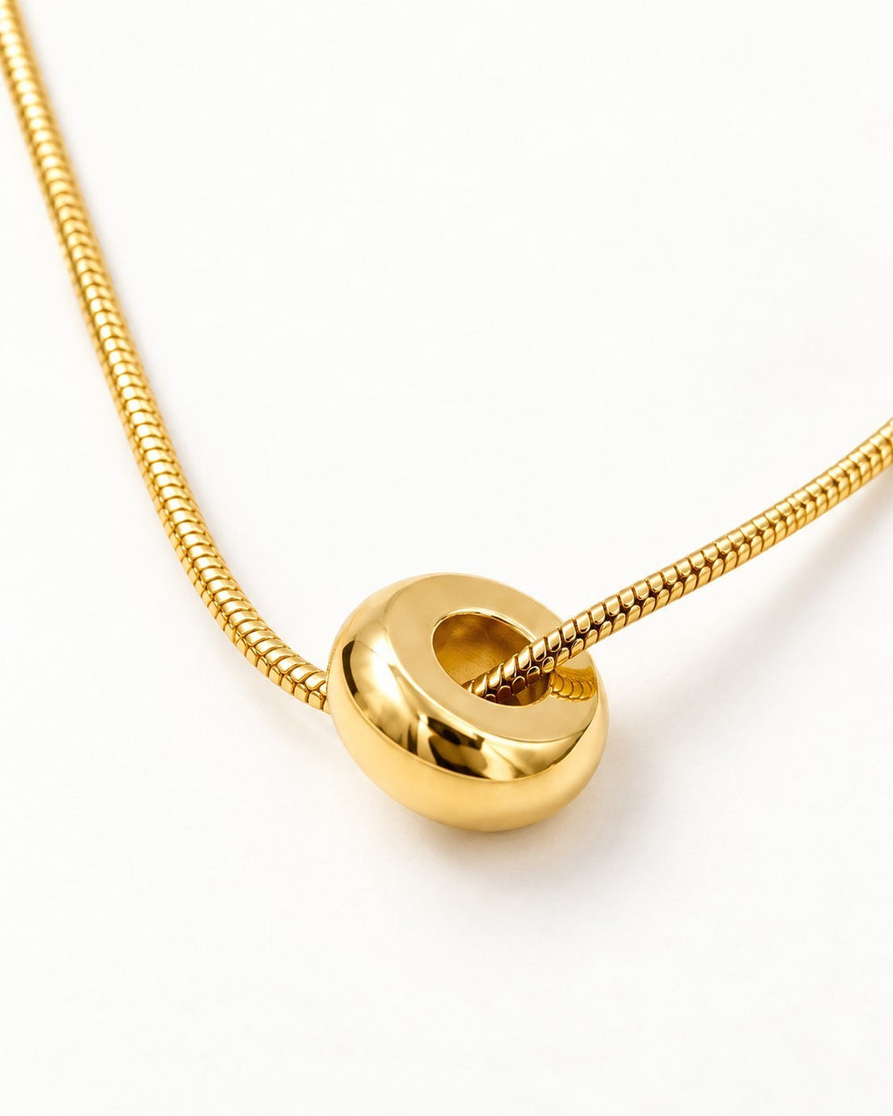 Elli Jewellery gold plated waterproof snake chain necklace featuring a smooth polished circular pendant