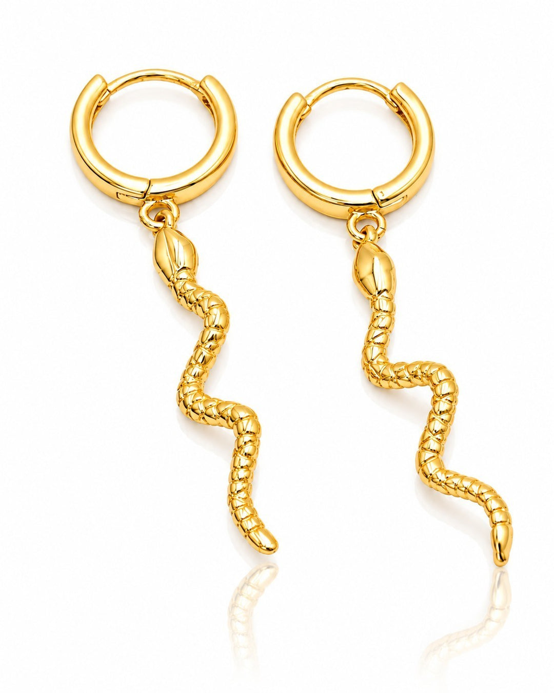 Elli Jewellery gold plated huggie hoop earrings featuring a dangling snake charm with detailed reptilian texture.
