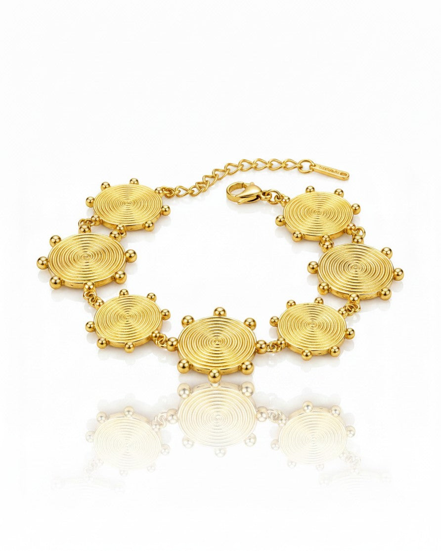 Elli Jewellery gold plated waterproof bracelet featuring circular spiral charms with delicate bead accents
