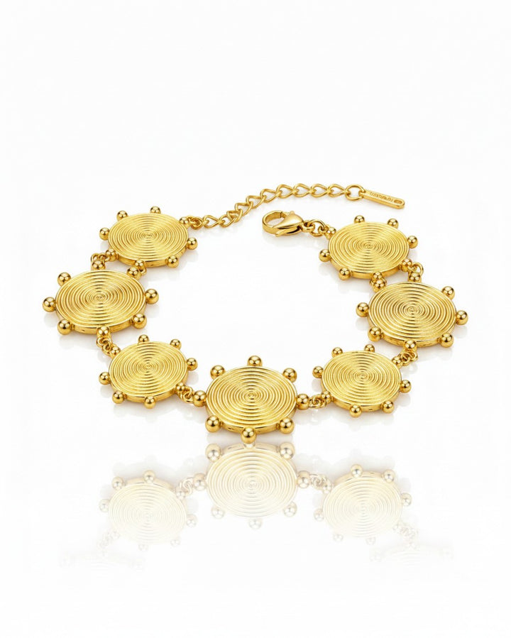 Elli Jewellery gold plated waterproof bracelet featuring circular spiral charms with delicate bead accents
