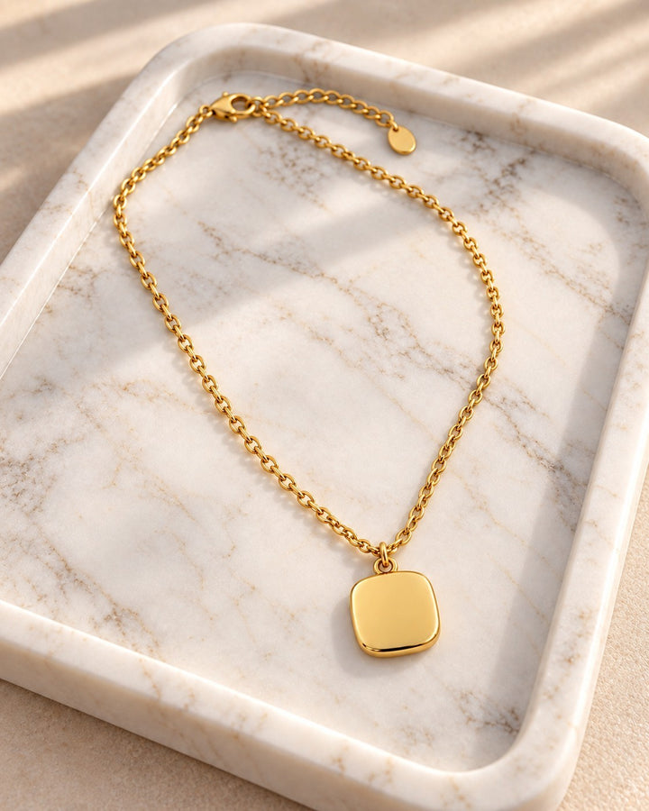 Elli Jewellery gold plated waterproof necklace featuring a minimalist geometric square pendant on a delicate chain.