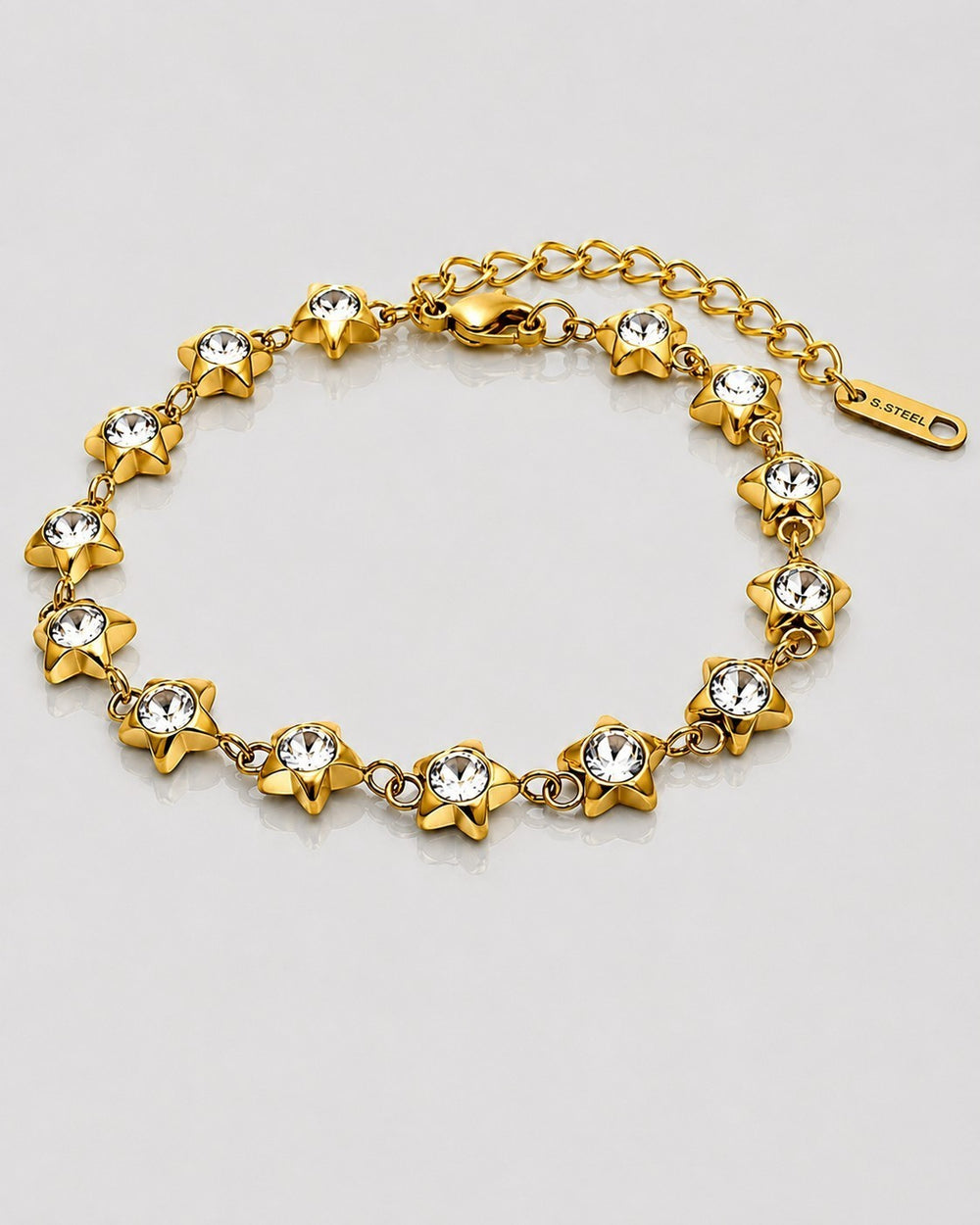 Elli Jewellery gold plated star charm bracelet featuring sparkling cubic zirconia stones and an adjustable clasp.