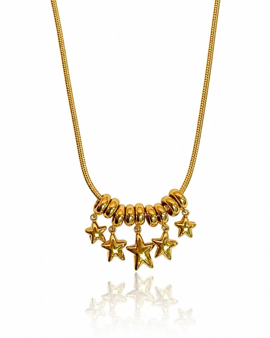 Elli Jewellery gold plated necklace featuring a cluster of rondelle beads and five polished star charms on a chain.