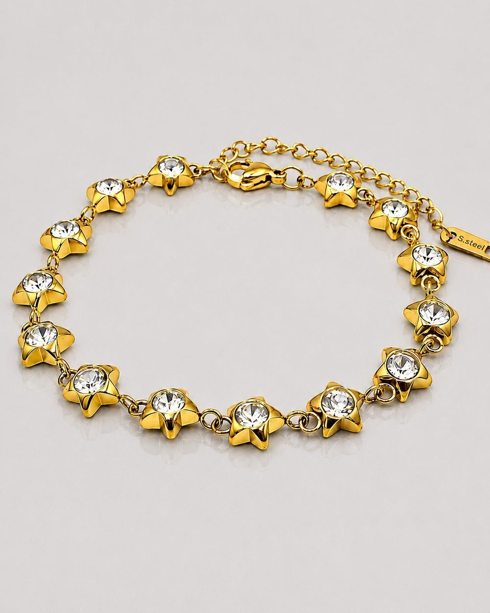 Elli Jewellery gold plated waterproof bracelet featuring star charms with embedded clear crystals on a delicate chain