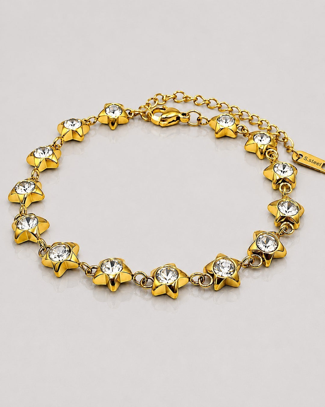 Elli Jewellery gold plated waterproof bracelet featuring star charms with embedded clear crystals on a delicate chain
