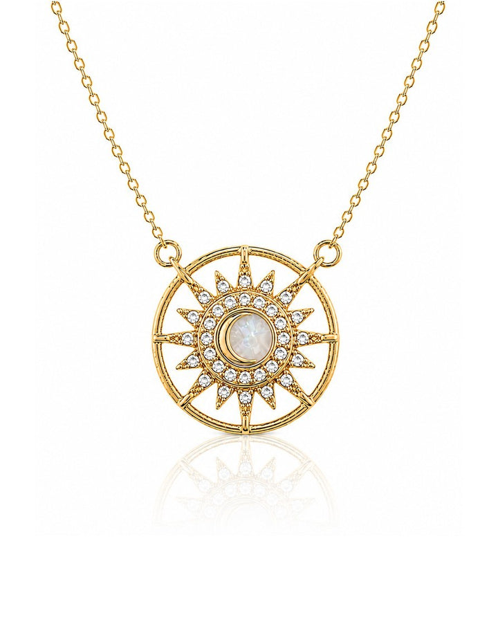 Elli Jewellery gold plated starburst medallion pendant necklace with a cream cabochon center and crystal accents.
