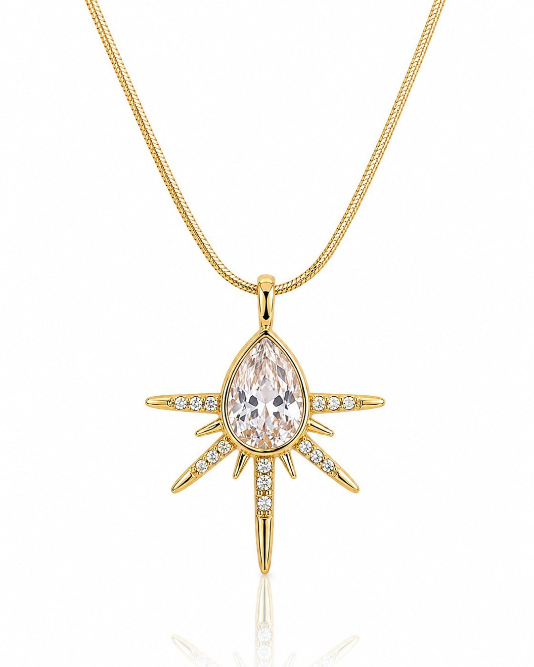 Elli Jewellery gold plated starburst pendant necklace featuring a central pear-shaped crystal and pavé stone accents.