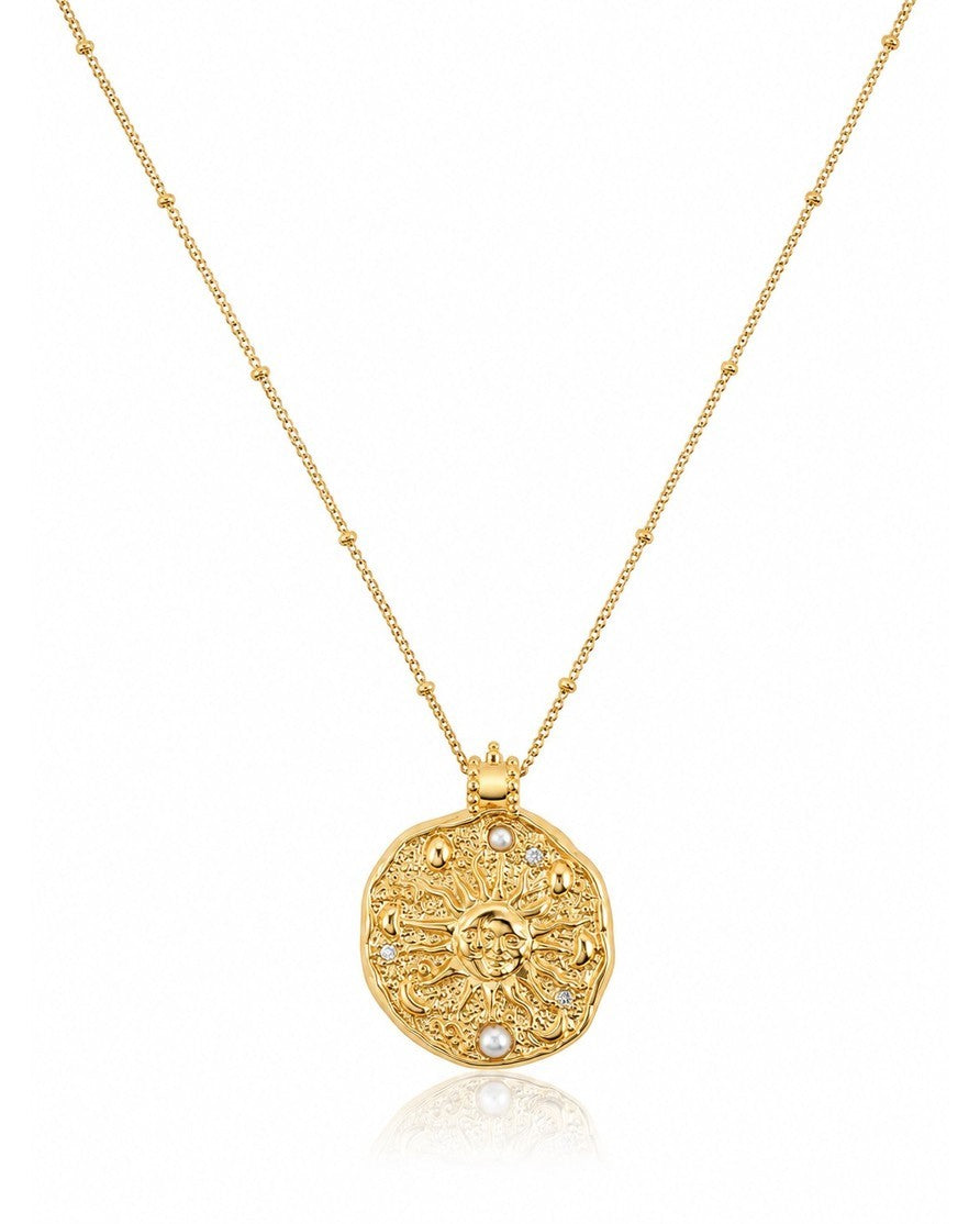 Elli Jewellery celestial sun medallion necklace in 18ct gold plate with pearl accents and a delicate station chain.