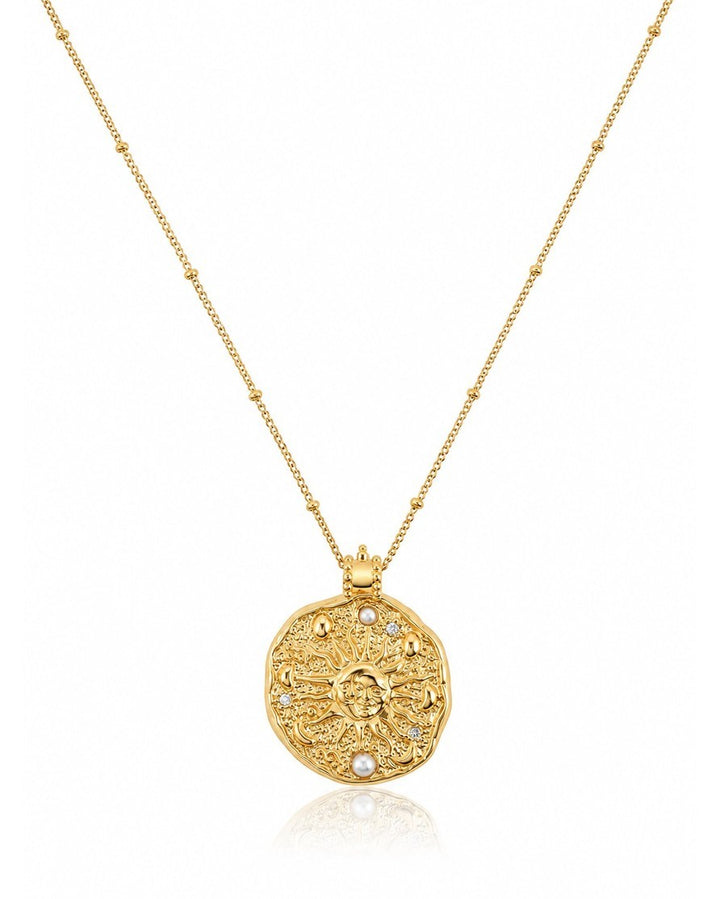 Elli Jewellery celestial sun medallion necklace in 18ct gold plate with pearl accents and a delicate station chain.