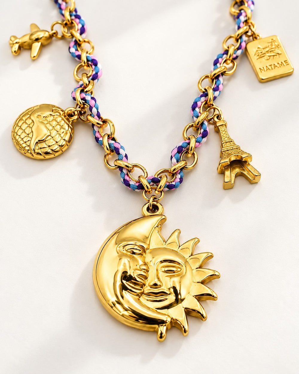Elli Jewellery gold plated sun and moon charm necklace on a braided purple and blue chain with travel-themed charms
