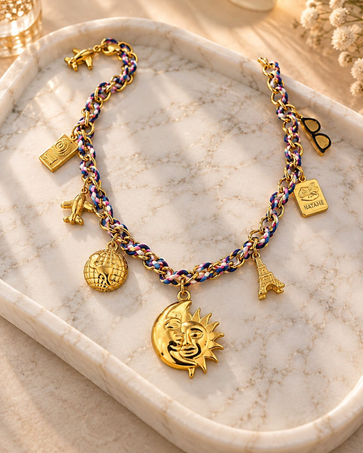 Elli Jewellery gold plated charm necklace featuring a sun and moon pendant on a braided multi-colored chain