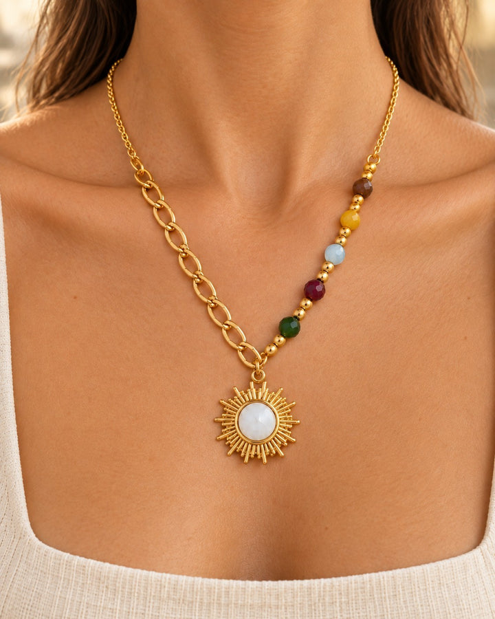 Elli Jewellery gold plated sunbeam pendant necklace featuring a sunburst design and multicolour beaded chain detail
