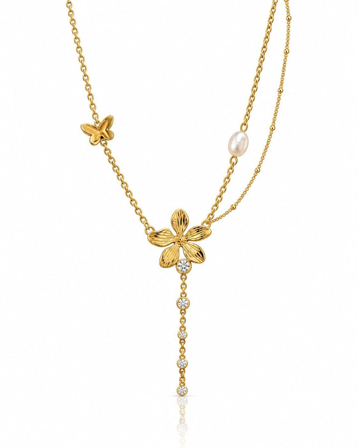 Elli Jewellery gold plated dainty necklace featuring a sunflower charm, butterfly, pearl, and crystal drop accents.