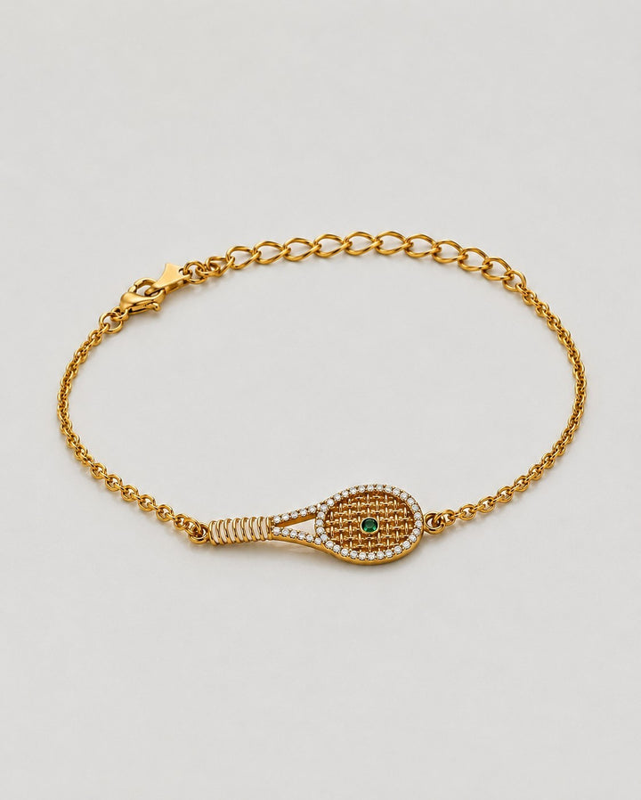 Elli Jewellery gold plated tennis racquet charm bracelet with pavé crystals and a green crystal ball on a chain