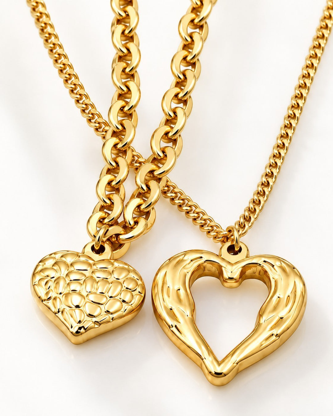 Elli Jewellery gold plated waterproof necklaces featuring a textured solid heart and an open heart pendant design.