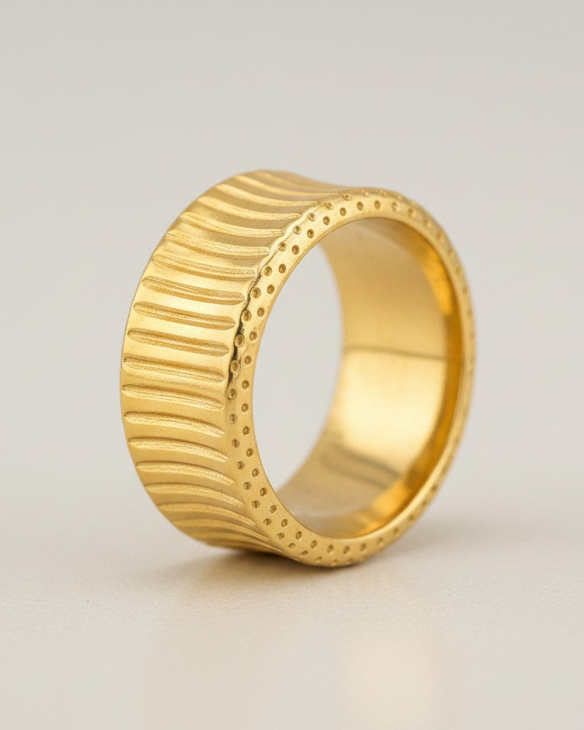 Elli Jewellery gold plated waterproof inverse band ring with a textured, ribbed pattern and dotted edges.