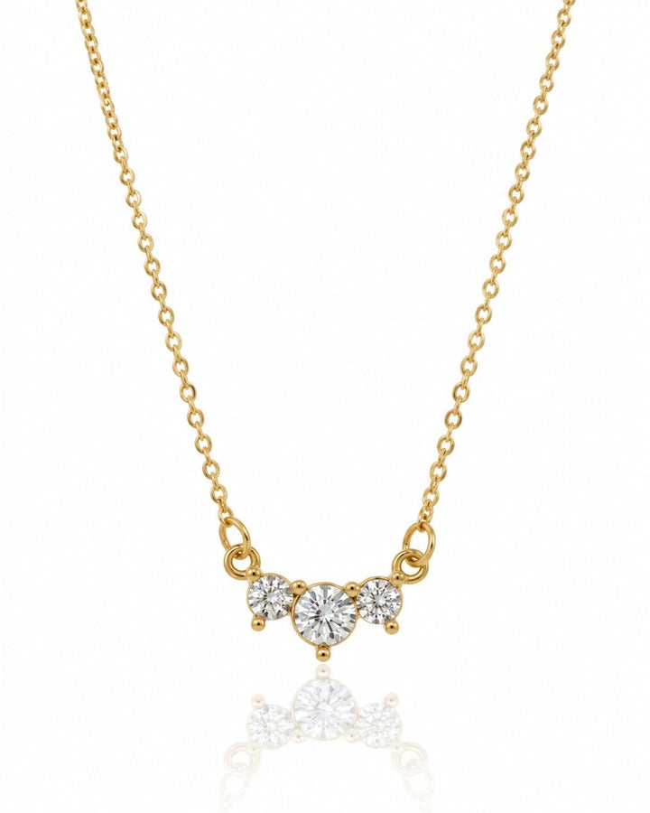 Elli Jewellery gold plated necklace featuring a trilogy drop pendant with three sparkling cubic zirconia stones.