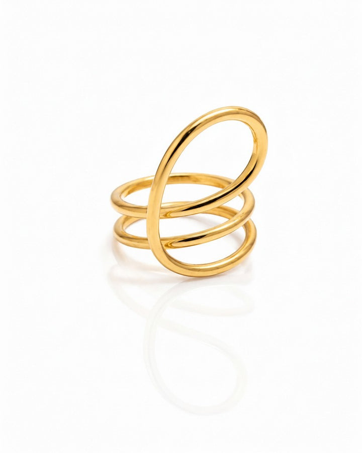 Elli Jewellery gold-toned statement ring featuring a bold, sculptural twisted dome design with a smooth finish.