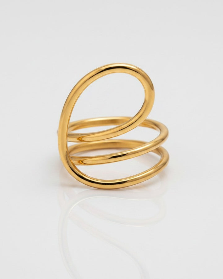 Elli Jewellery gold-toned statement ring featuring a sculptural twisted dome design with a smooth, polished finish.