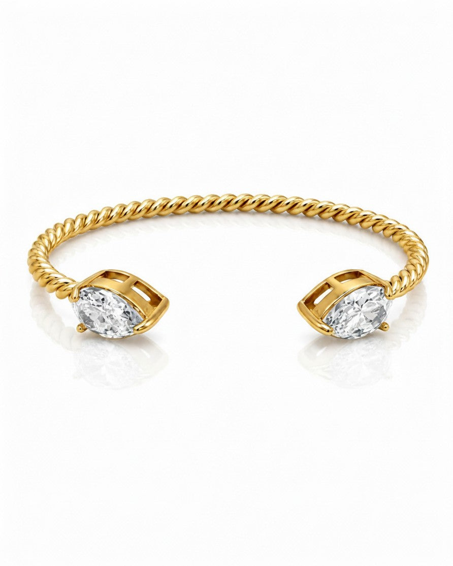 Elli Jewellery gold plated waterproof twisted rope cuff bracelet featuring two marquise-cut clear stones at the ends.