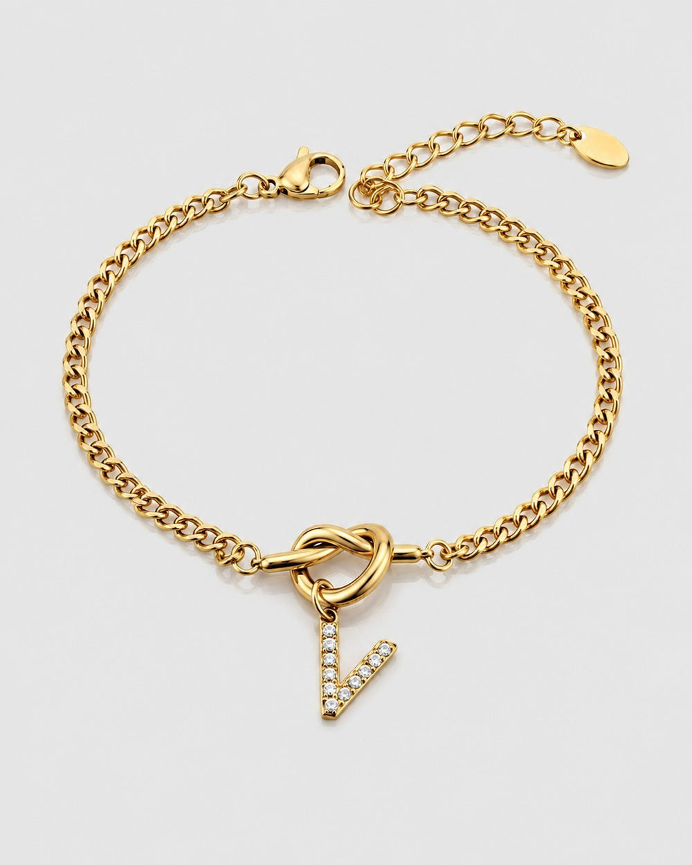 Elli Jewellery gold plated chain bracelet featuring a central knot detail and a crystal-encrusted V-shape charm.