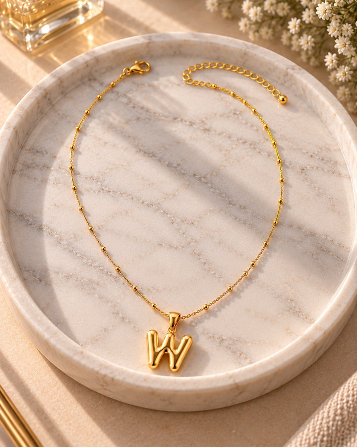Elli Jewellery gold plated chain necklace featuring a chunky letter W initial pendant on a delicate beaded chain