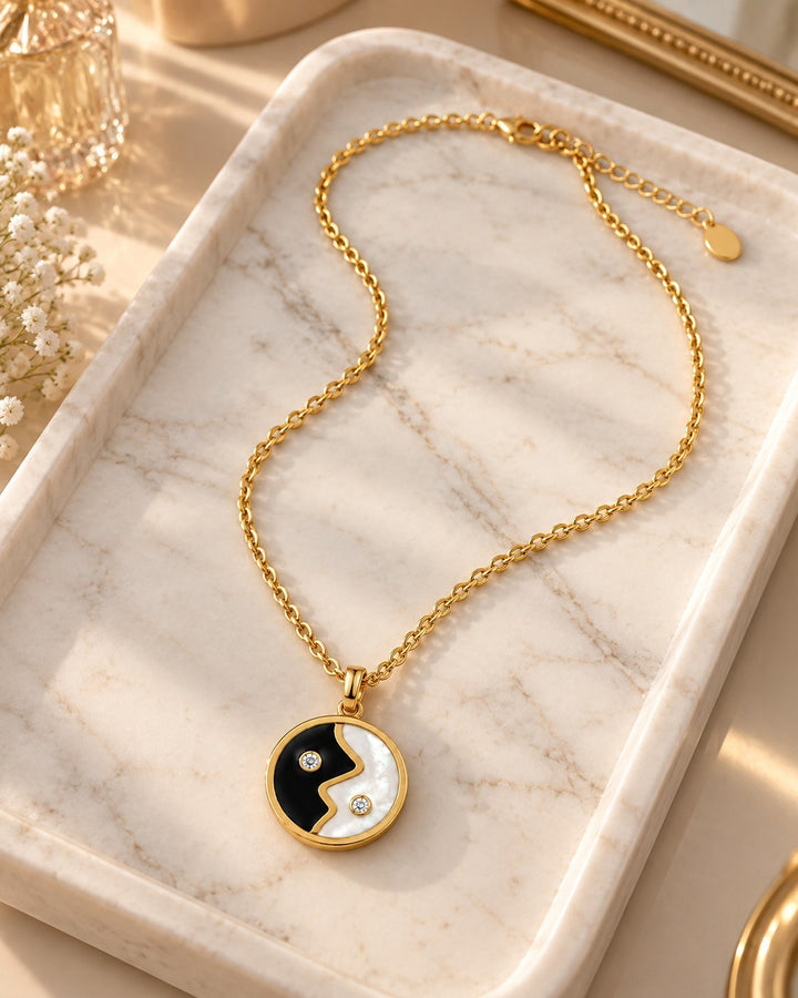 Elli Jewellery gold plated yin yang pendant necklace with black and white enamel and small sparkling crystals