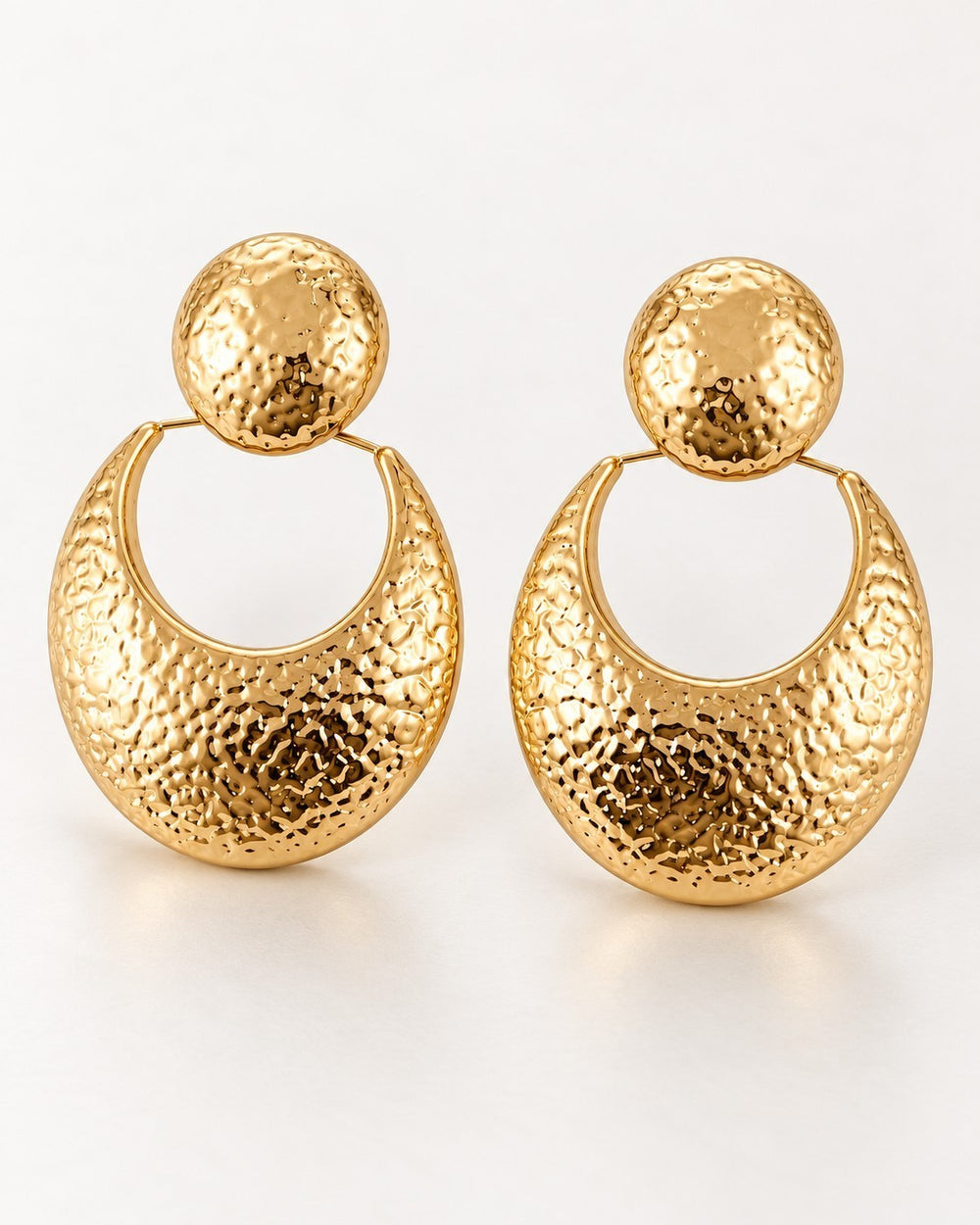 Elli Jewellery hammered 18ct gold plated crescent drop earrings with circular stud tops on a white background
