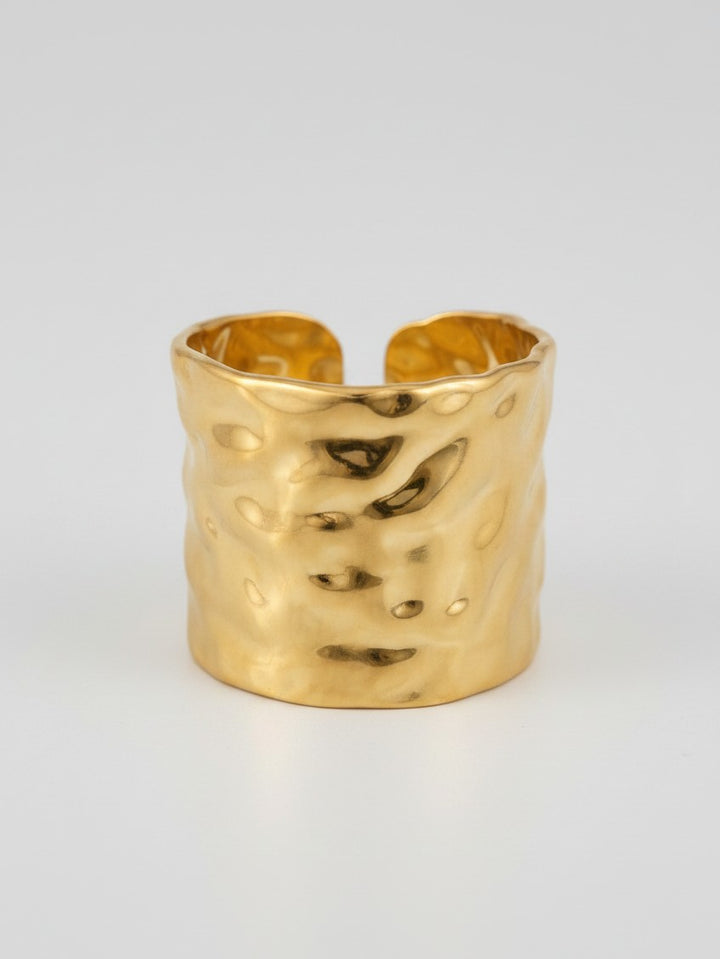 Elli Jewellery wide band ring in 18ct gold plated metal with a hammered dimpled texture and adjustable open back.