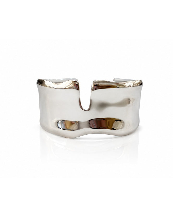 Elli Jewellery rhodium plated statement bangle featuring a wide, hammered texture design in a polished silver tone.
