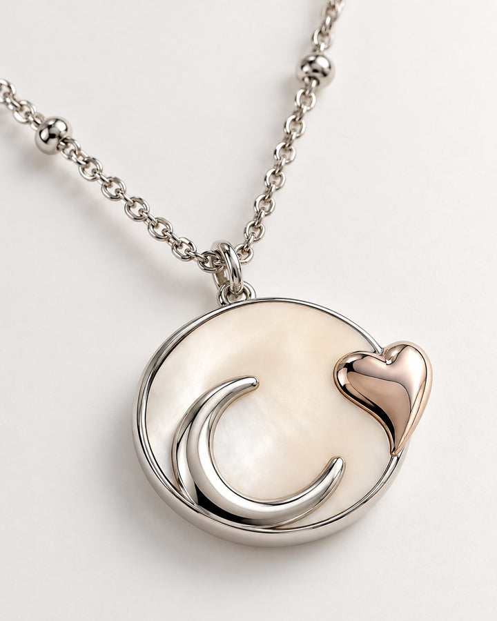 Elli Jewellery rhodium plated necklace featuring a mother of pearl disc with a silver moon and rose gold heart charm.