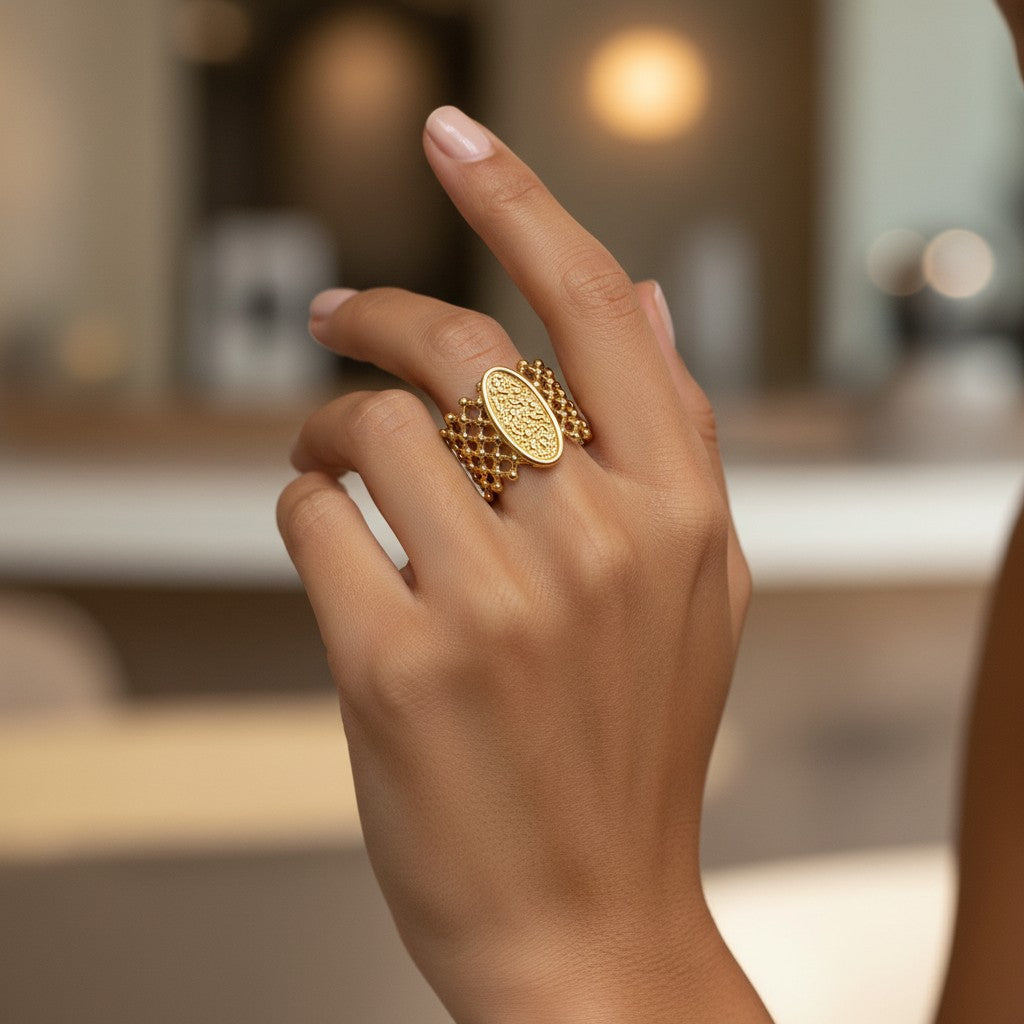 Elli Jewellery oval granulated gold plated statement ring with mesh band worn on a finger